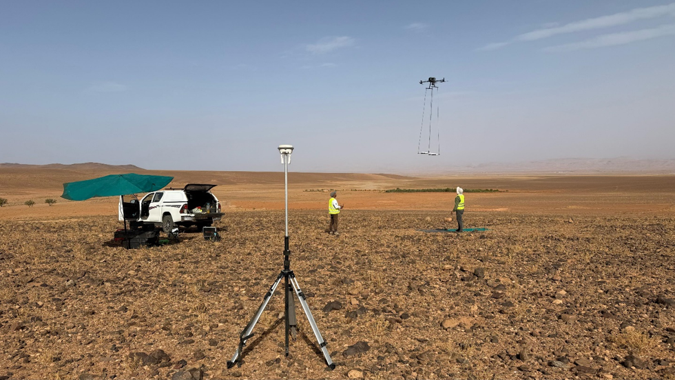 UAV towing a magnetometer above a desert survey area