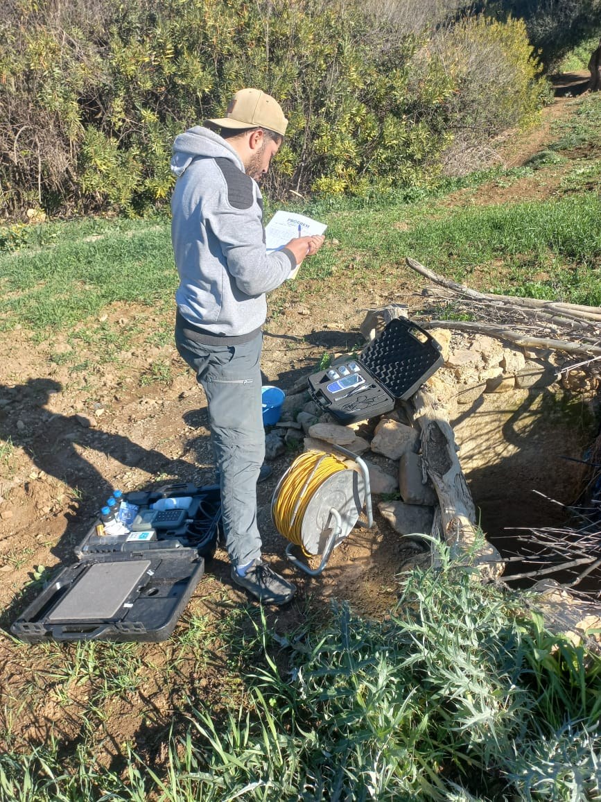 PROGREM hydrogeologist recording in-situ water-quality measurements at a well