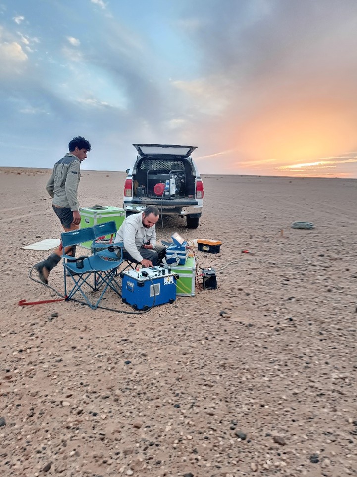 PROGREM operators preparing equipment at sunset